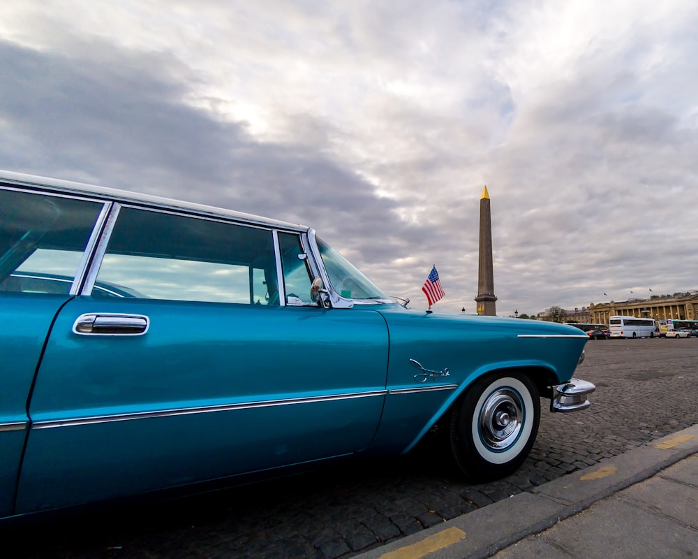 blue car on road during daytime