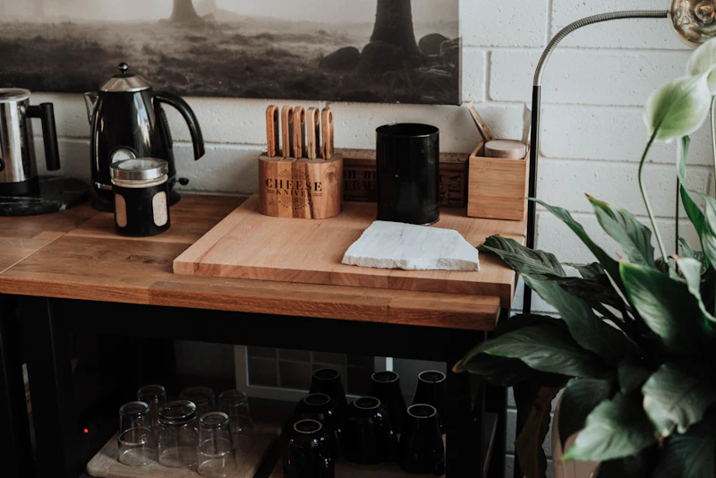 Wooden modular desk organizer with compartments on a wooden desk