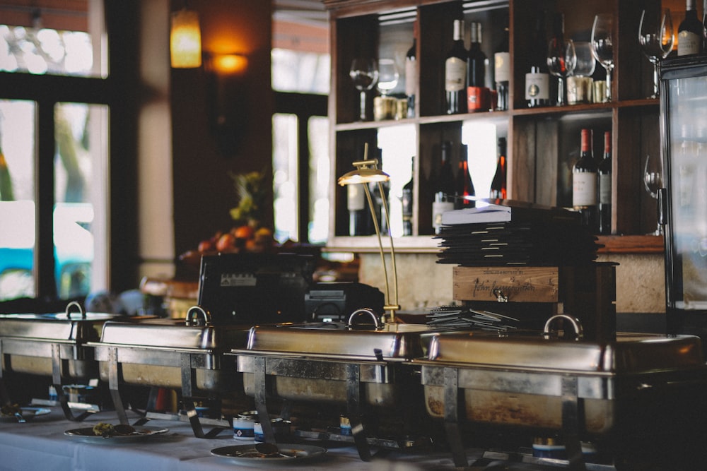 gray food containers near bar counter inside room