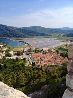 A scenic view of Ukrainian countryside with travelers exploring a charming village.