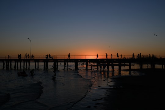 silhouette of people on bridge during sunset in Altona Australia