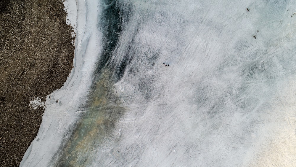 an aerial view of a body of water covered in ice