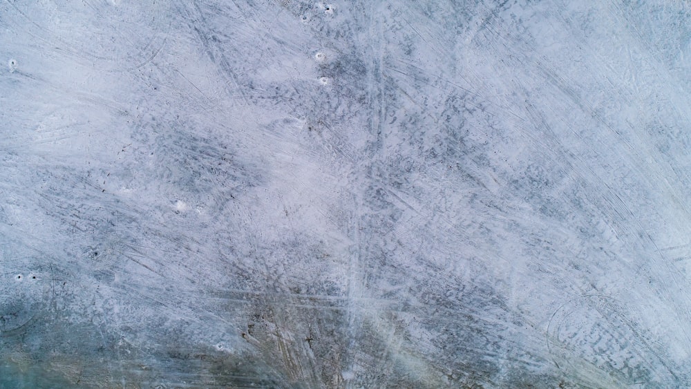 an aerial view of a snow covered field