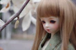 A delicate doll with intricately crafted clothing, perfect for gift giving.