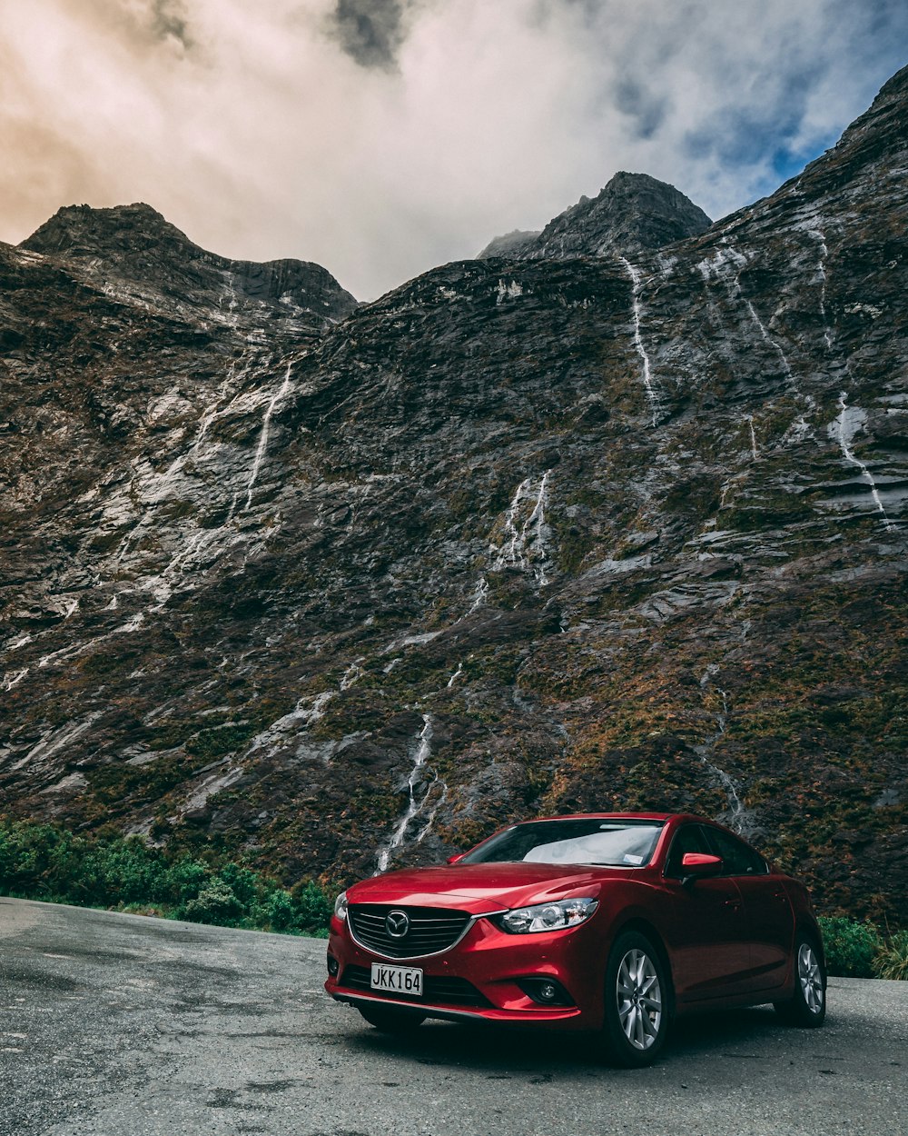 red Mazda vehicle