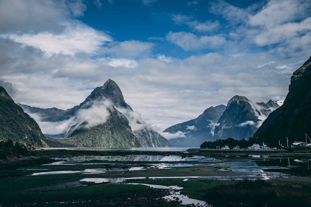 body of water surrounded by mountains