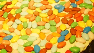 Close-up of elegant personalized sugared almonds in delicate pastel colors.