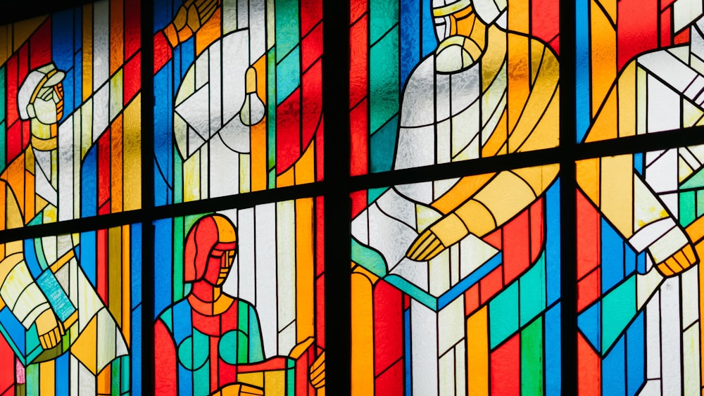 man reading stain glass window