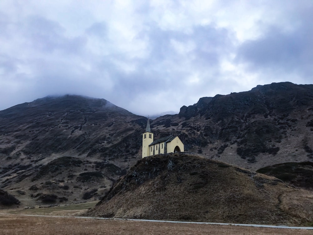 white building surrounded by hills