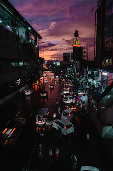 A vibrant snapshot of a bustling city street at dusk, capturing the energy and movement.