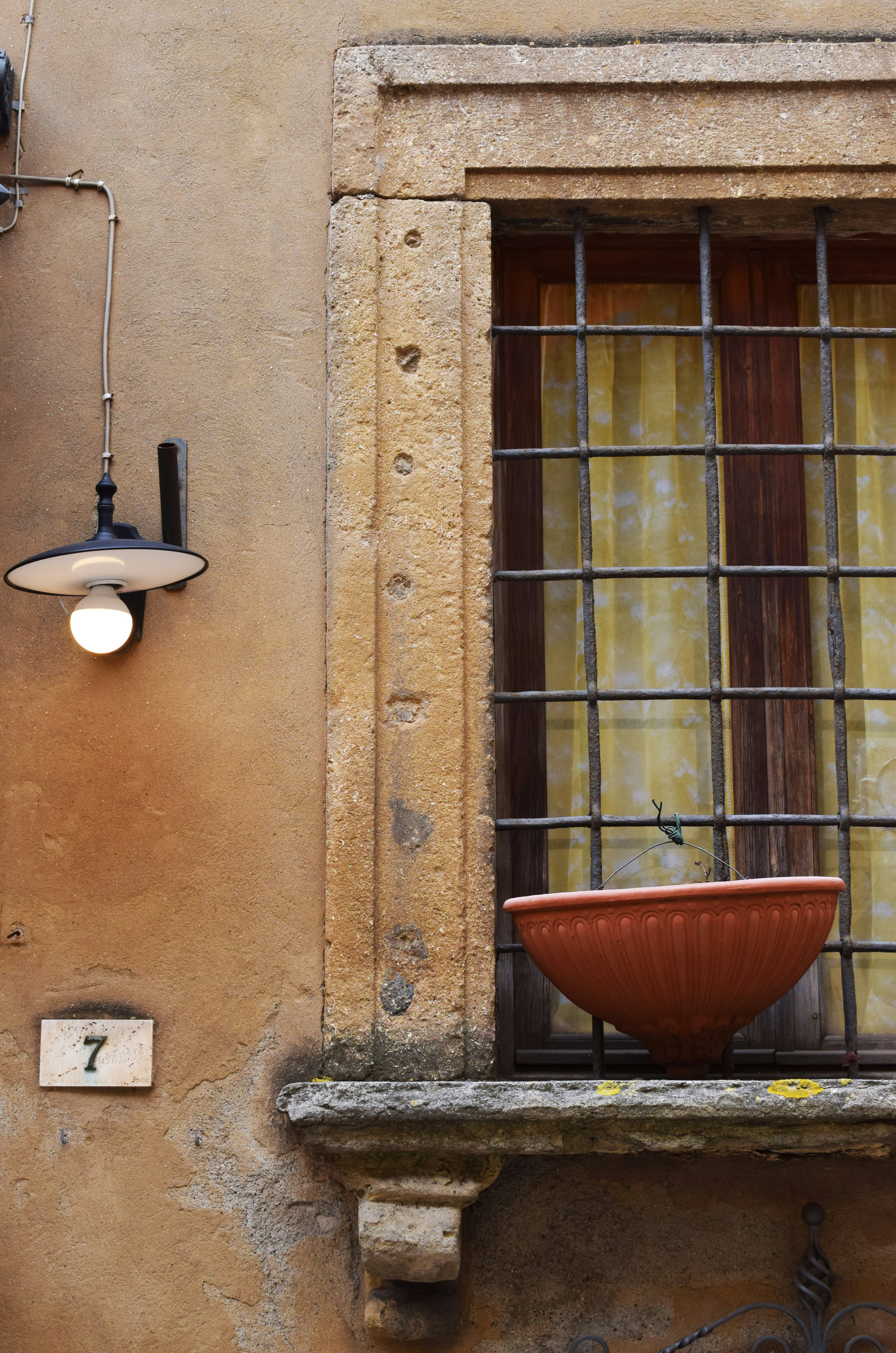 brown planter pot on window