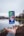 silver iPhone X floating over open palm
