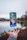 silver iPhone X floating over open palm