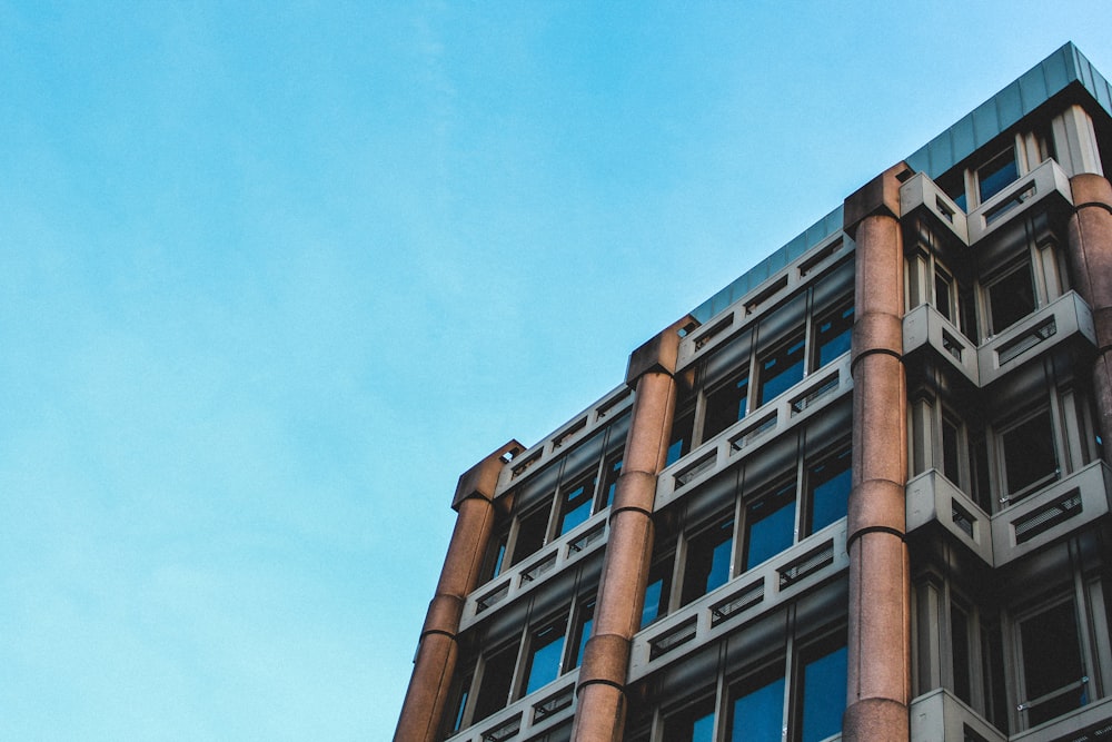 low angle photography of building under blue sky