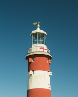 red and white lighthouse during daytime