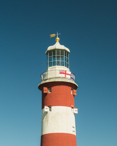 red and white lighthouse during daytime