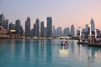 body of water with high-rise building in distance