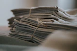 Stacks of neatly rolled woven elastics ready for shipment.