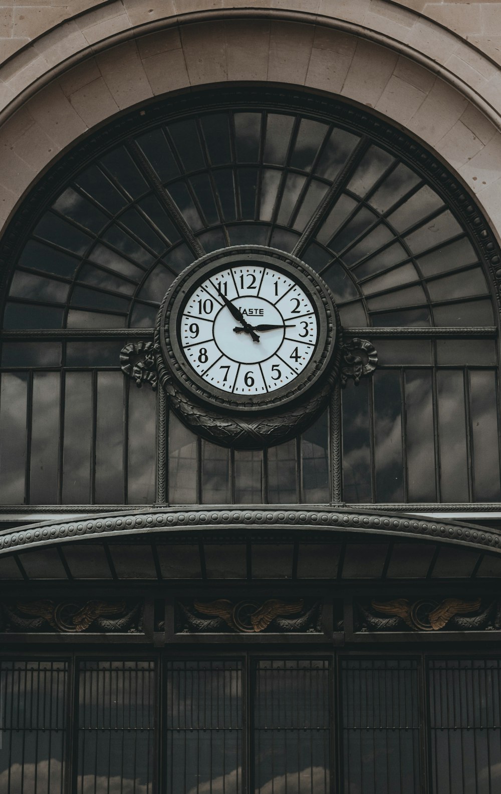 round brown analog clock in building