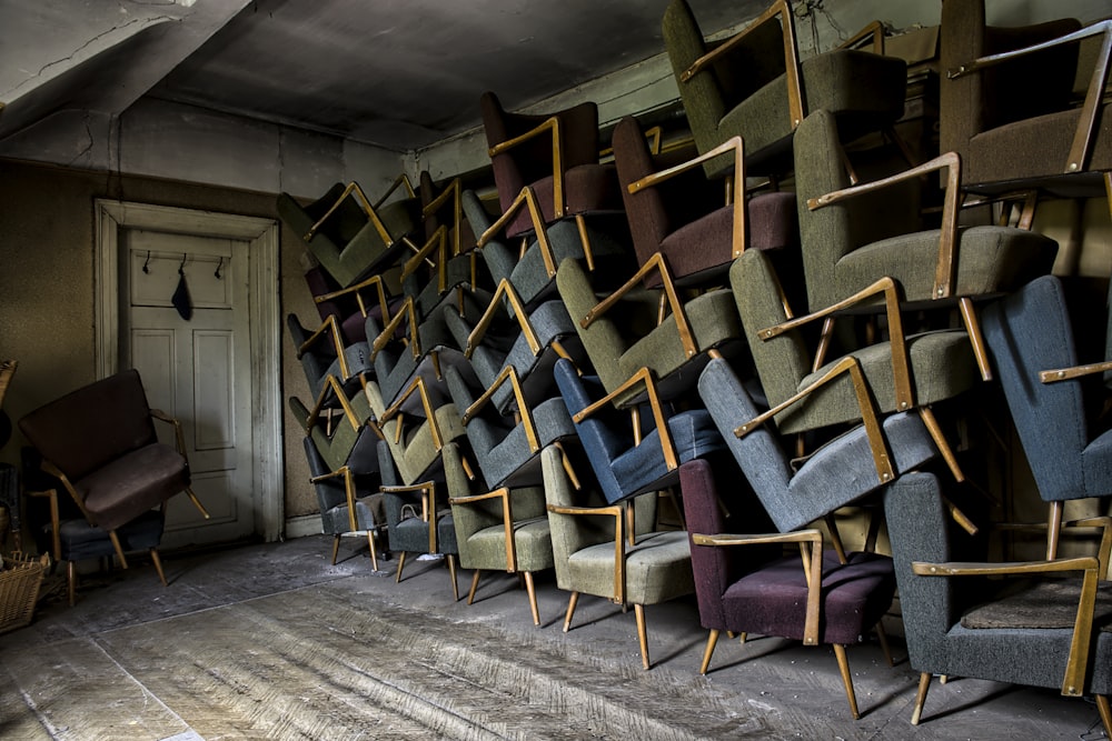 assorted armchair on wall near door