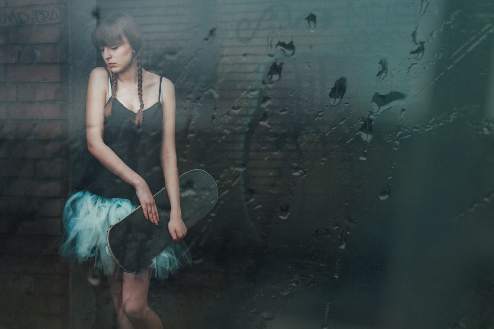 woman standing in front of wall