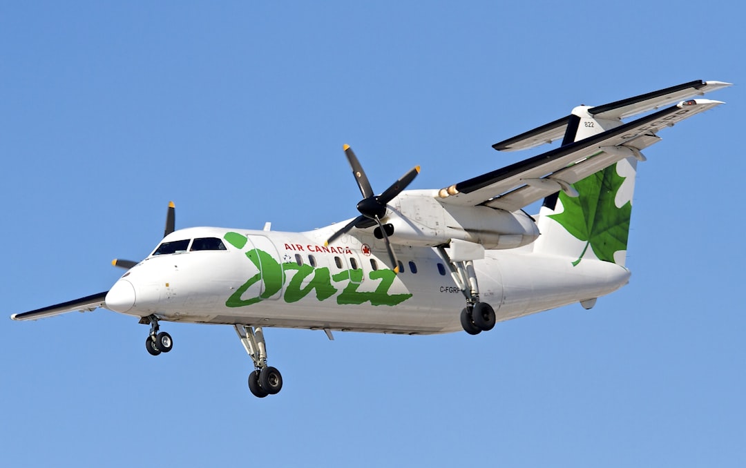 white and green monoplane in the air, Air Canada Jazz
