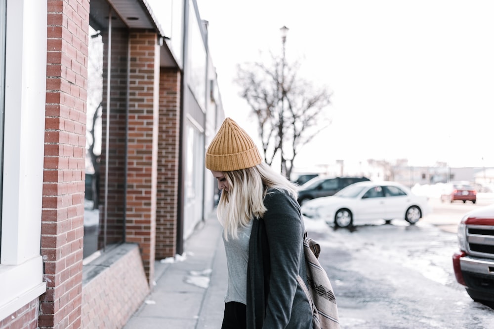 woman standing near building