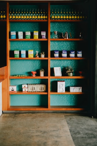 A shelf lined with local crafts and coffee beans, reflecting the blend of culture and lifestyle at aksa.