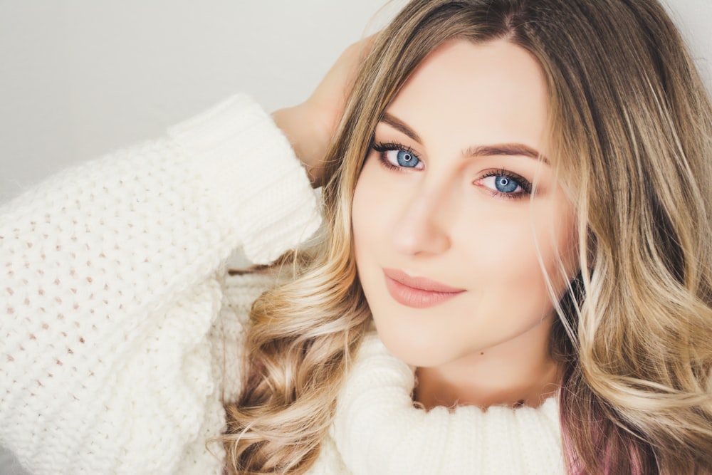 woman wearing white sweater closeup photography