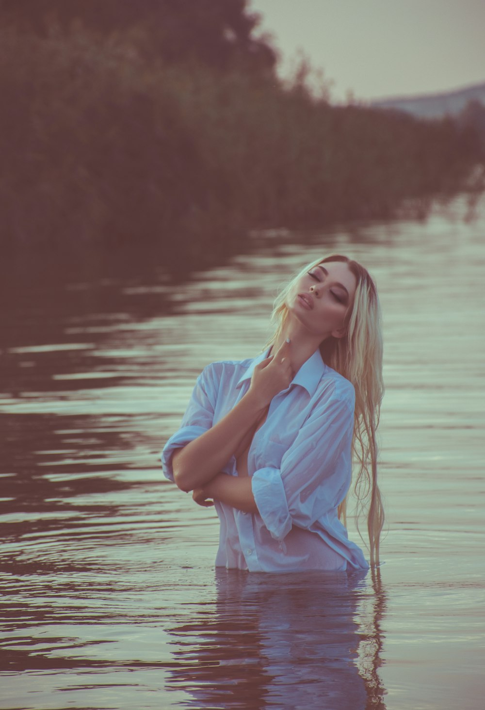 woman standing on body of water