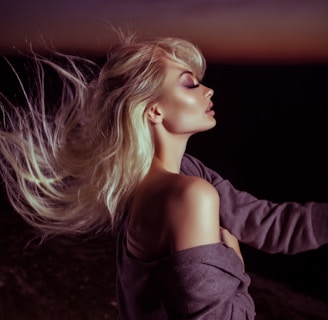 woman wearing gray jacket with blonde hair