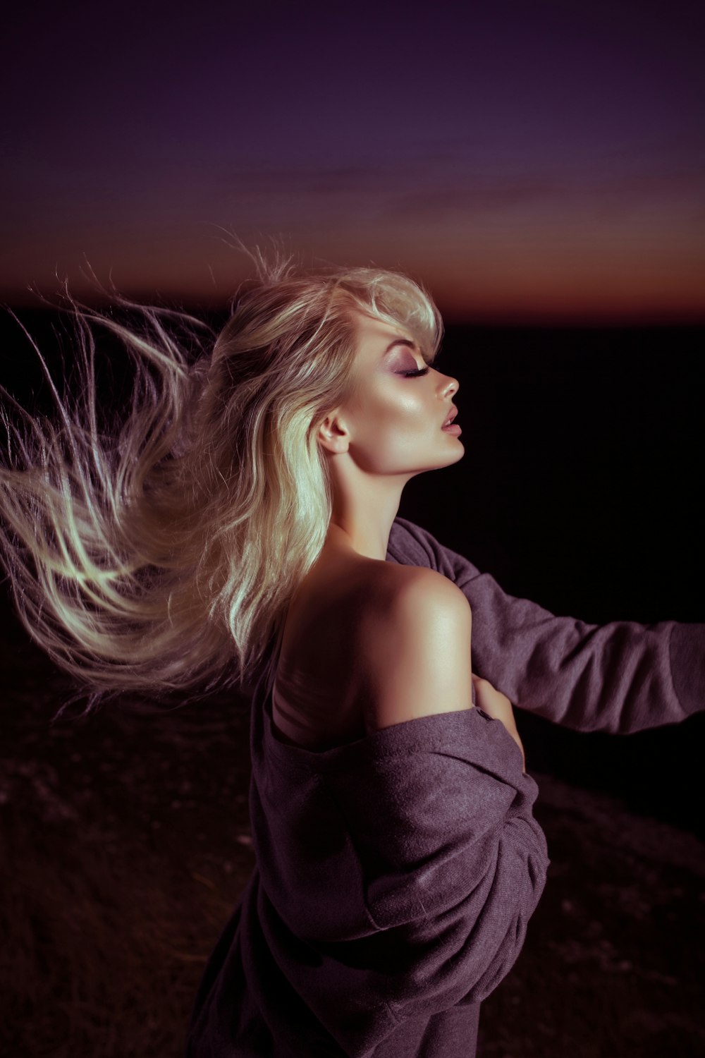 woman wearing gray jacket with blonde hair