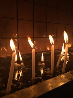 A peaceful meditation space with candles and water.