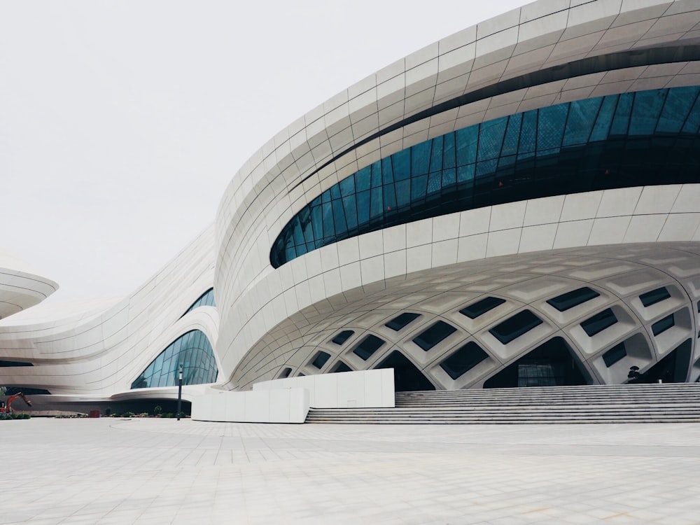 white building structure with blue glass windows