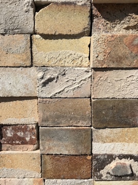 Close-up of detailed brickwork and modern finishes on a custom-built wall.