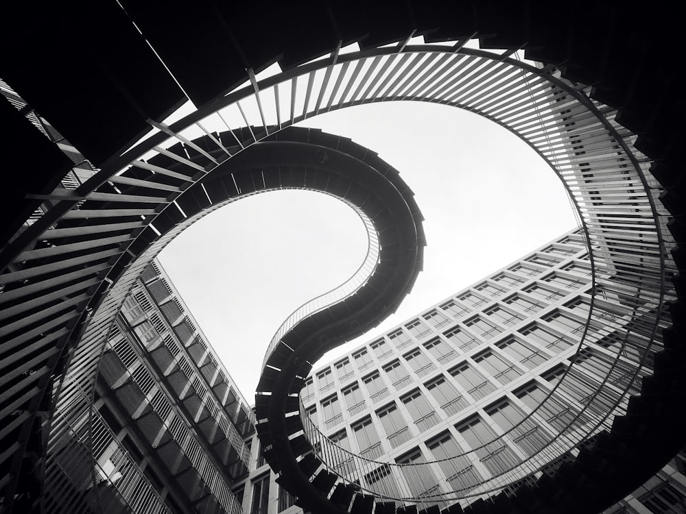 grascale photo of spiral stairs