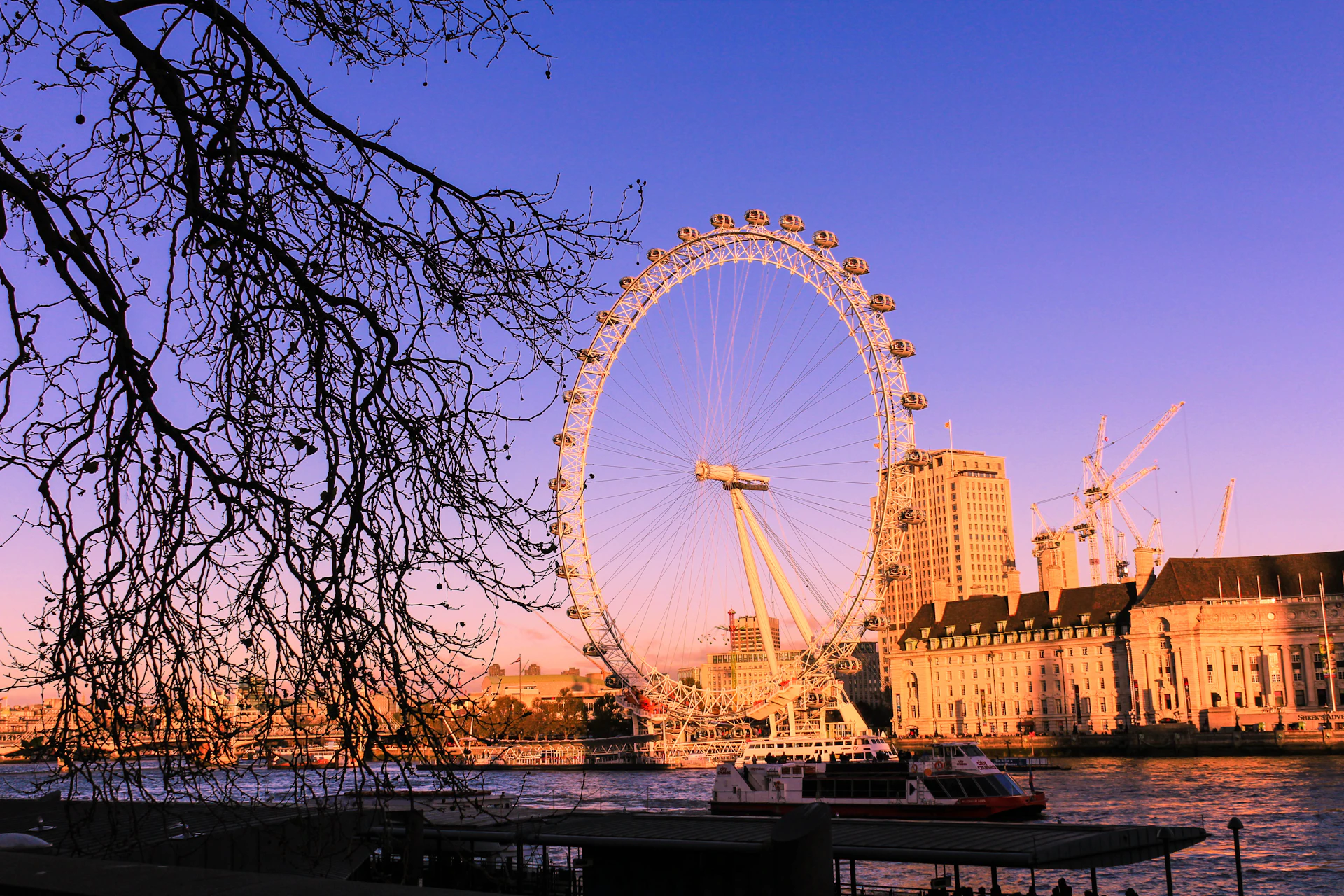 London Eye at sunset over the Thames - UK national security landmark