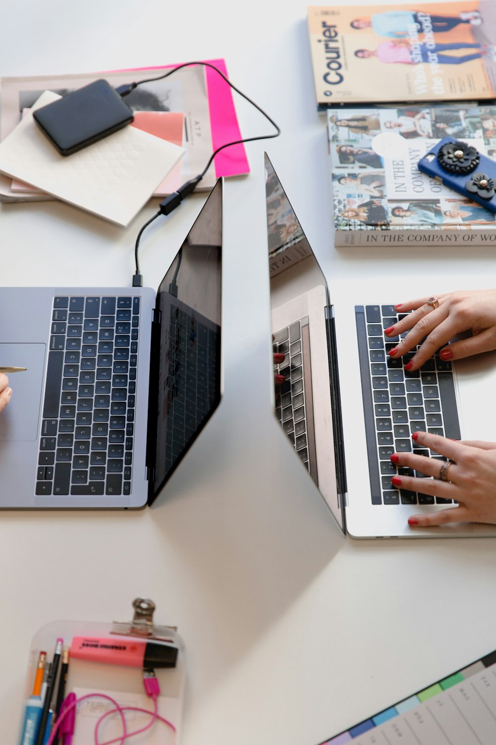 person typing on silver laptop computer