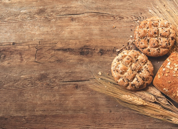 cookies, bread, and wheat on table