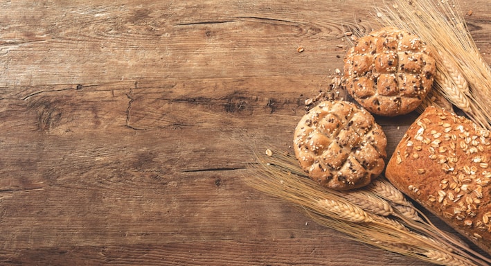 cookies, bread, and wheat on table