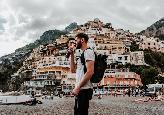man wearing white crew-neck shirt in Amalfi Coast Italy