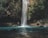 waterfalls between trees at daytime