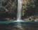 waterfalls between trees at daytime
