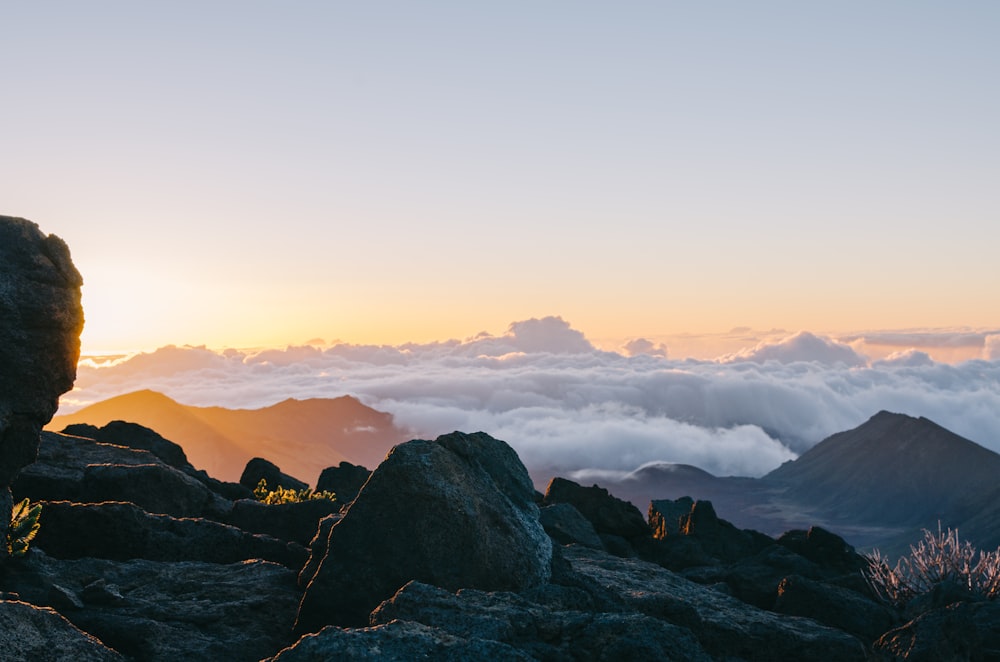 mountains covered by white clouds