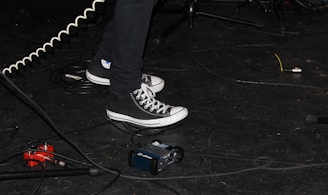 person standing beside white cable