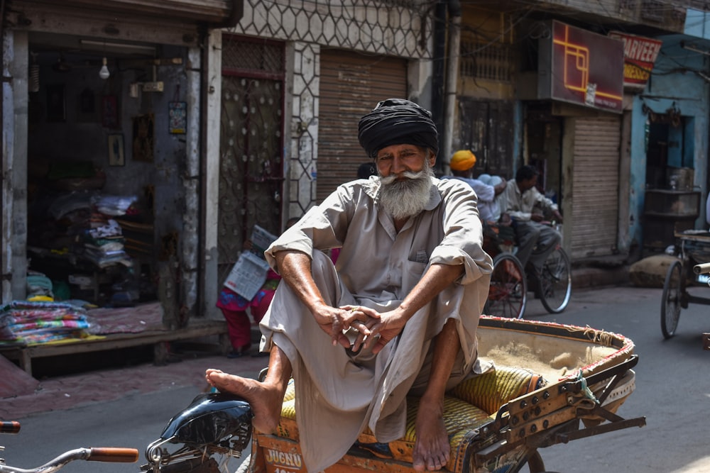 man sitting on trike