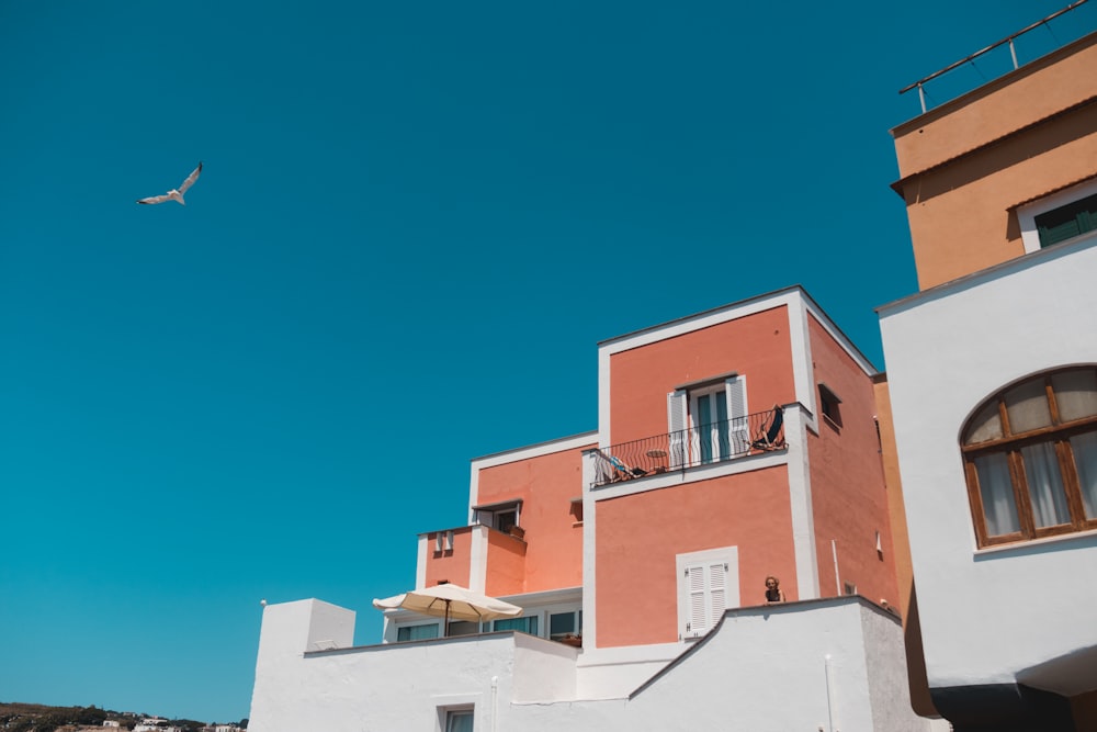 beige and white concrete house under clear sky