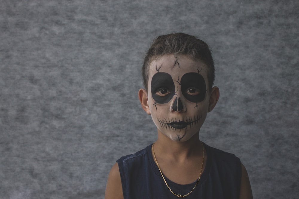 boy wearing black sleeveless shirt