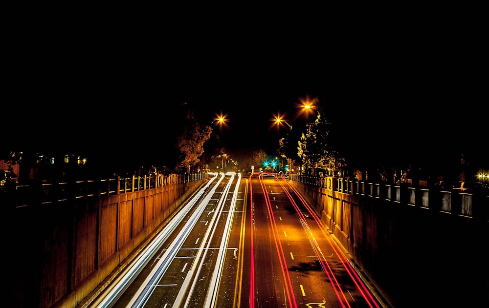 timelapse photography of cars passing through north and south