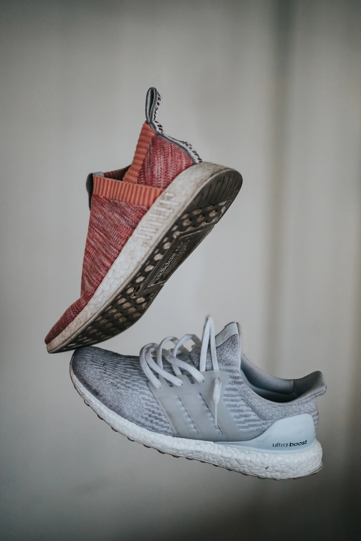 A worn pair of running shoes showing signs of wear